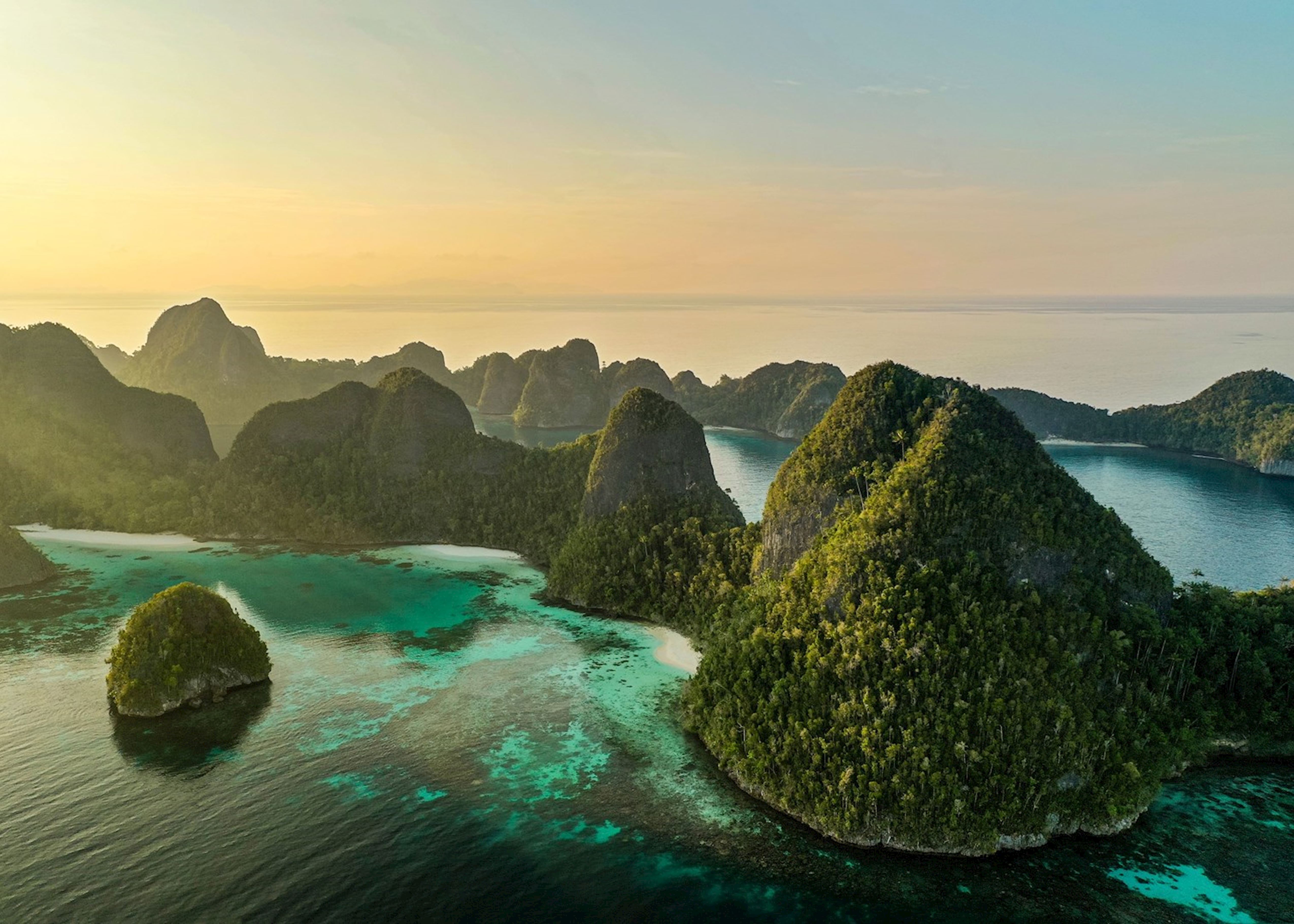 Raja Ampat limestone islands and turquoise reef water.