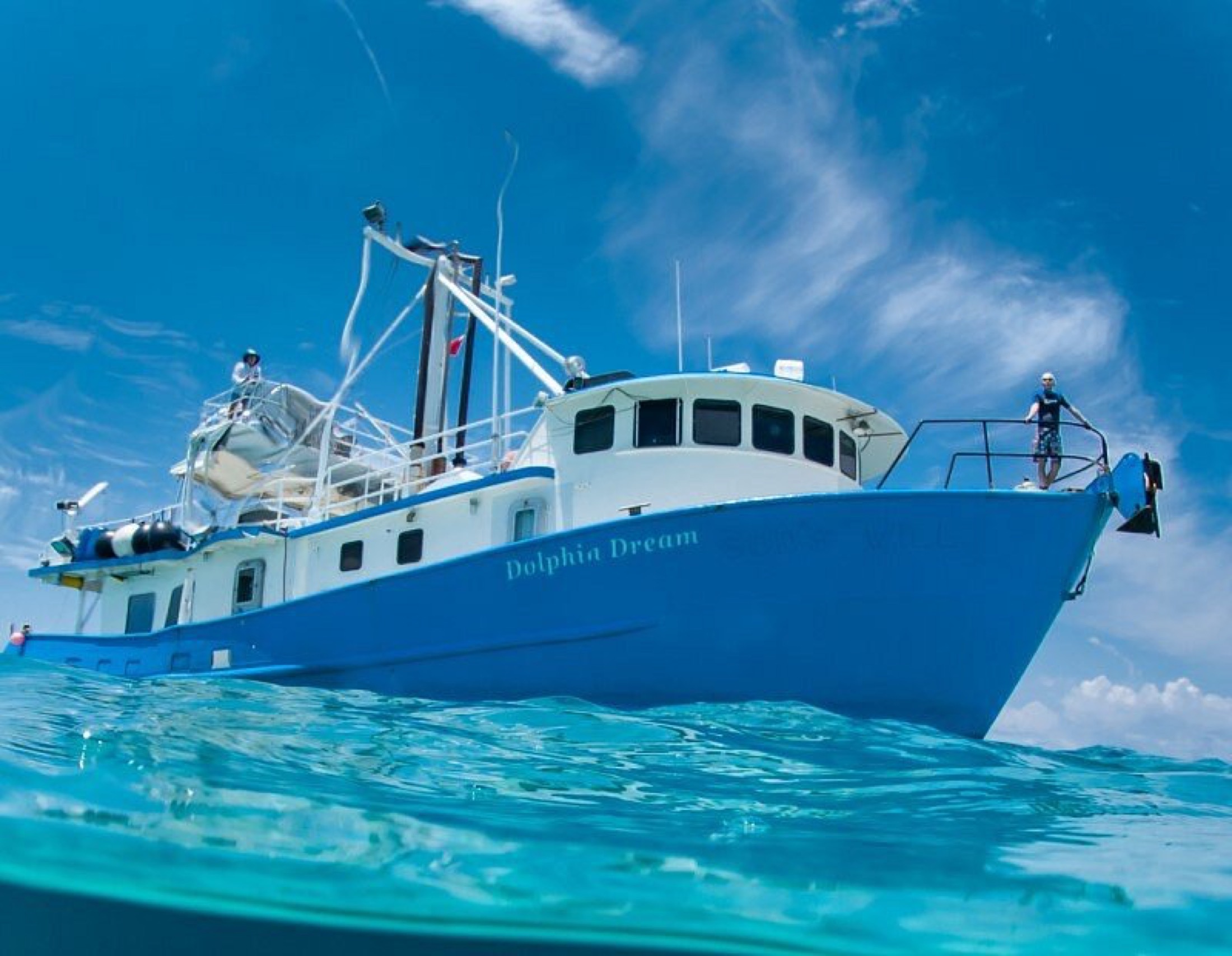 Dolphin Dream liveaboard floating on bright Bahamian water.
