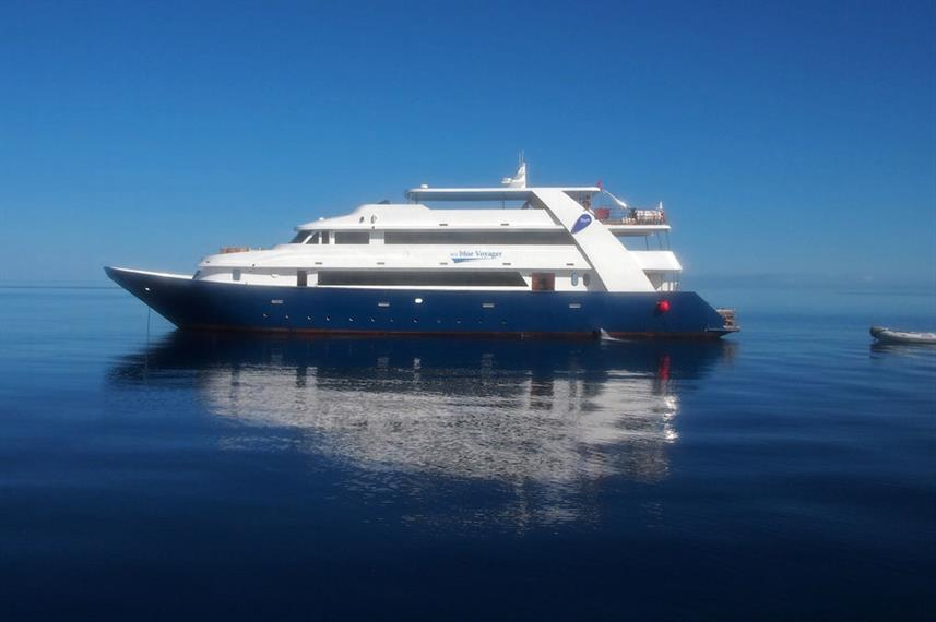 Blue Voyager liveaboard on calm Maldives water.