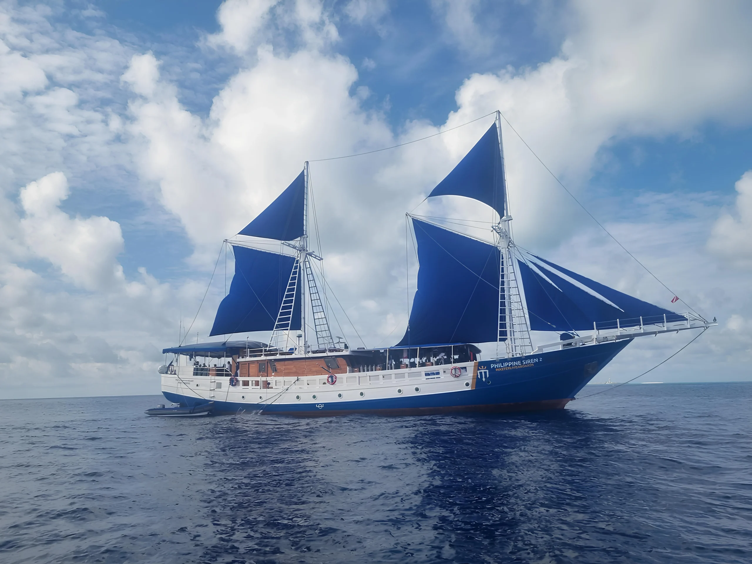 Philippine Siren liveaboard under sail in the Philippines.